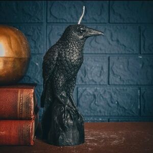 Highly-detailed and realistic-looking perched raven candle